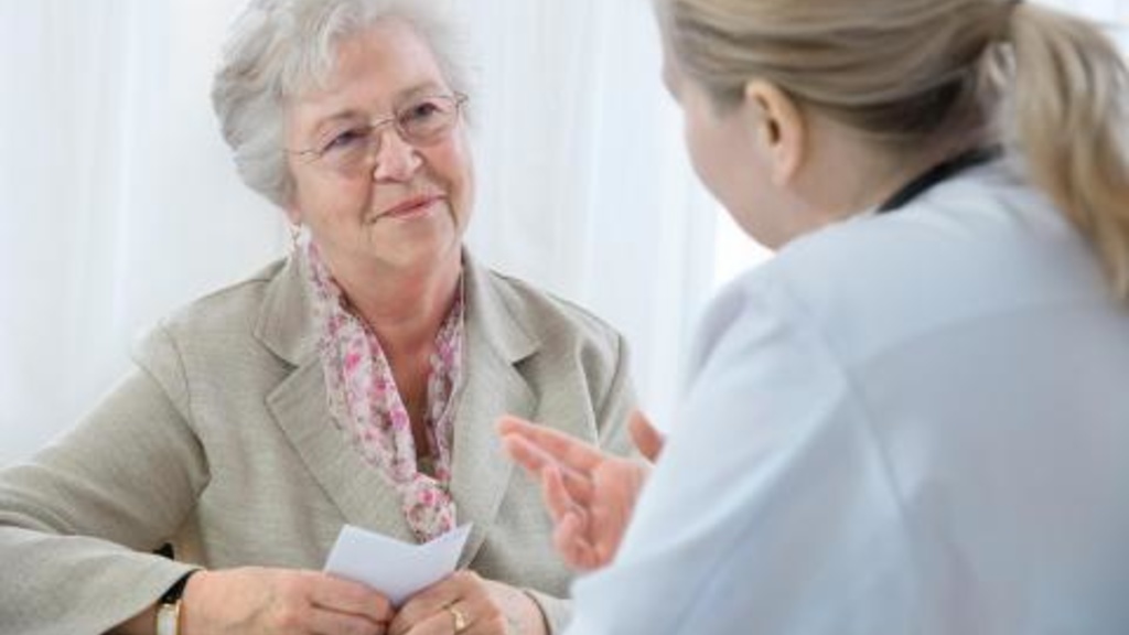 Physician speaking with an older patient
